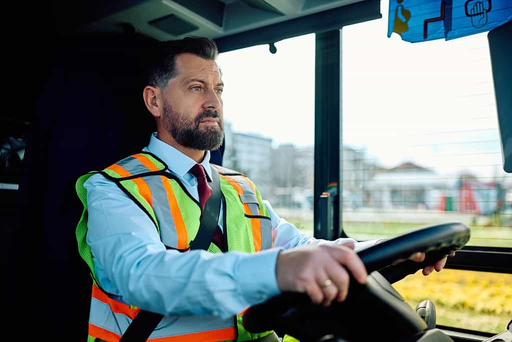 bus driver driving a bus in the city 2023 04 14 15 43 57 utc