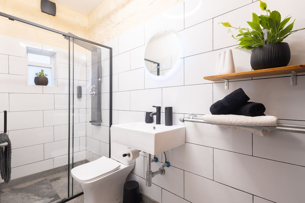 Bright ensuite bathroom with walk-in shower at The Retreat