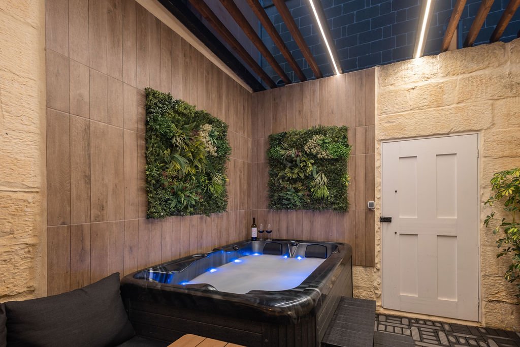 Illuminated private hot tub in The Retreat courtyard