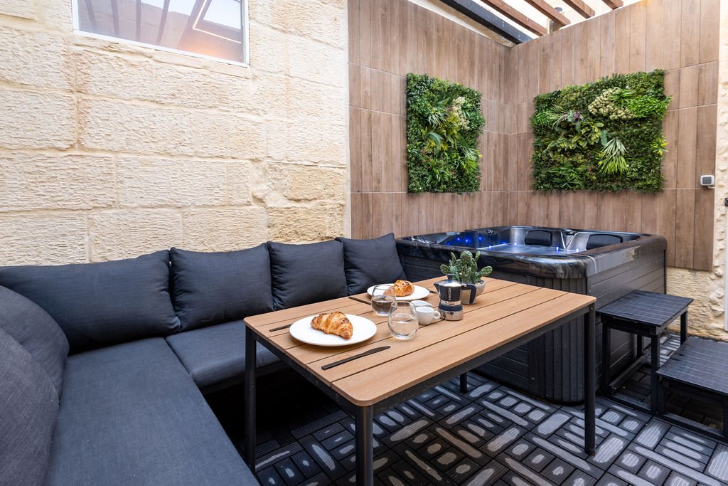 Private hot tub and stone courtyard at The Retreat in Gozo